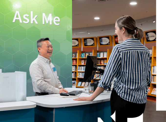 RPL staff helping a patron at the Ask Me desk